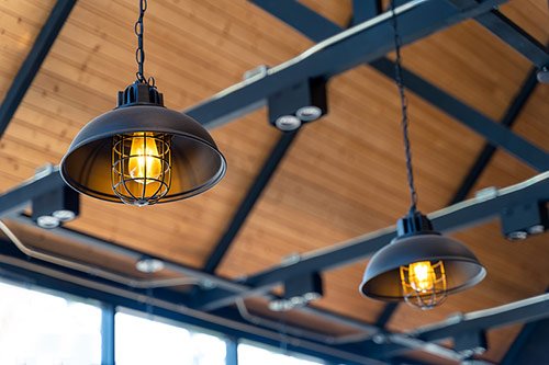 Hanging Edison lamps from a wood ceiling top view